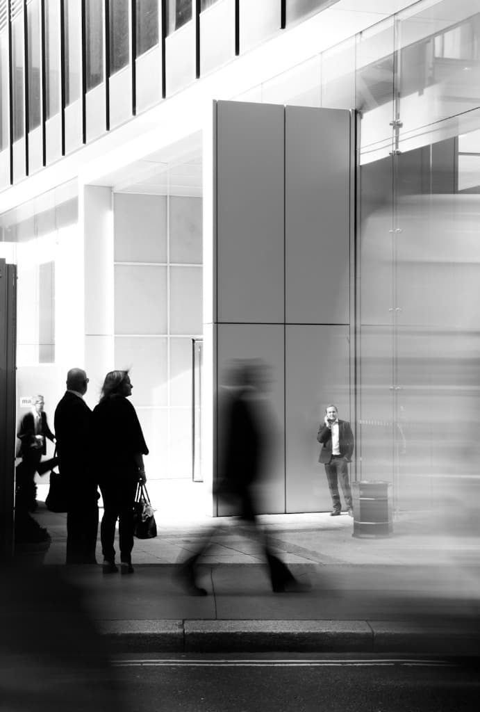 Executive in modern corporate glass building